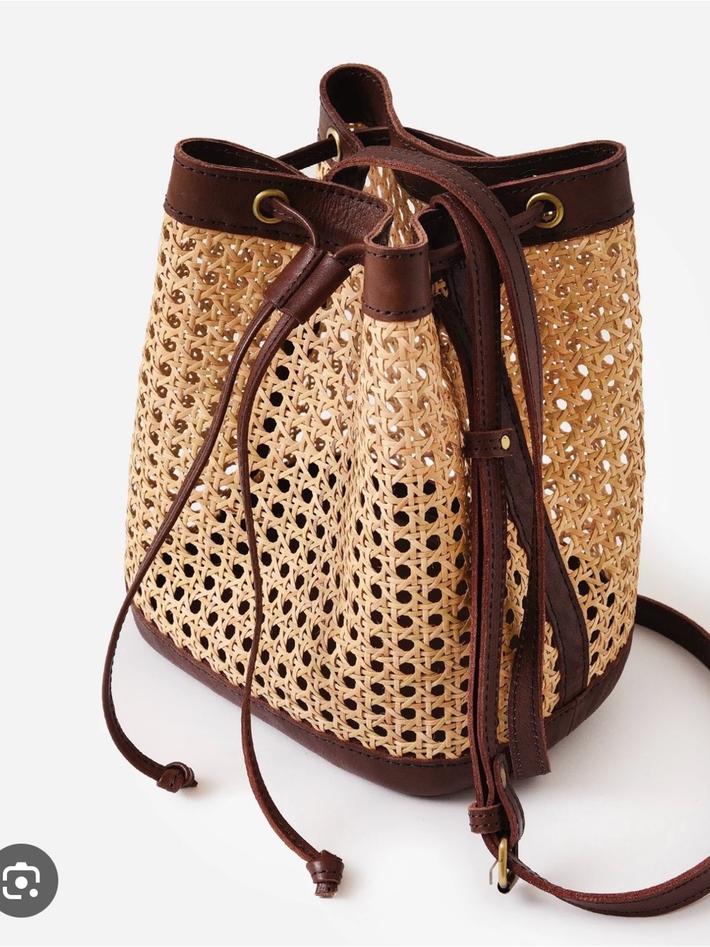 Woven Rattan Drawstring Crossbody Bag with Brown Trim